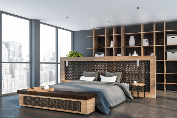 istock Gray master bedroom corner with bookshelves 1164597346
