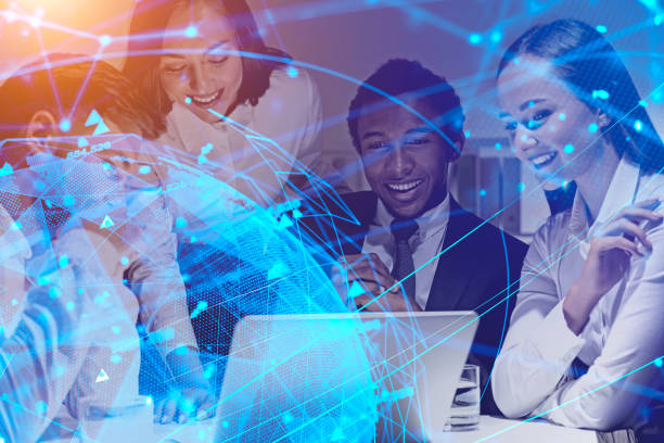 istock Happy business team in office, digital network 1164597412