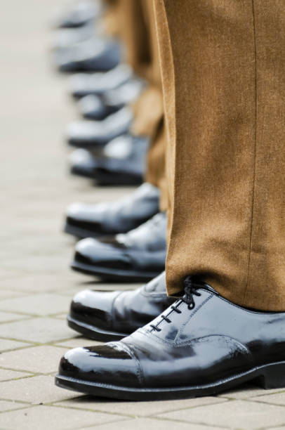 istock Soldiers in uniform with highly polished shoes 1164597444