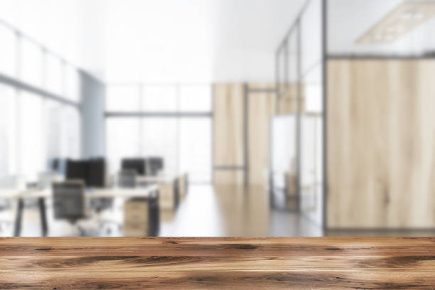 istock Gray and wooden open space office blurred 1164598099