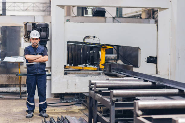 istock Man working at a factory-standing in workshop 1164600917