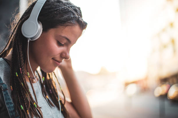 istock Young man listens to music and eats ice cream 1164601642