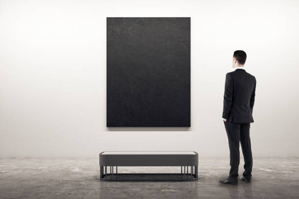 istock Businessman looking at poster 1164602605