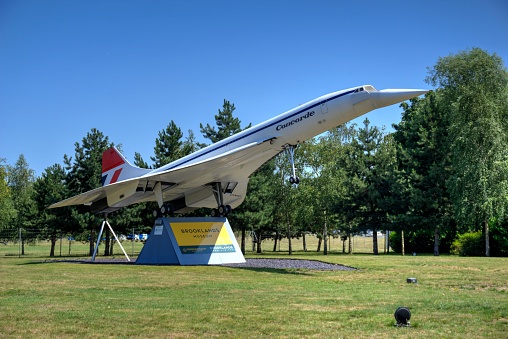 Weybridge, Surrey, United Kingdom - July 23, 2019: Signage and model of Concorde at entrance to Brooklands automotive and aviation museum