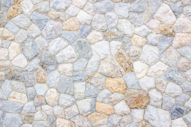 istock Brick stone wall stack of medieval natural stone texture background or rock strata boundary the rock seamless abstract and fragment of a walls from a gray. 1164609373