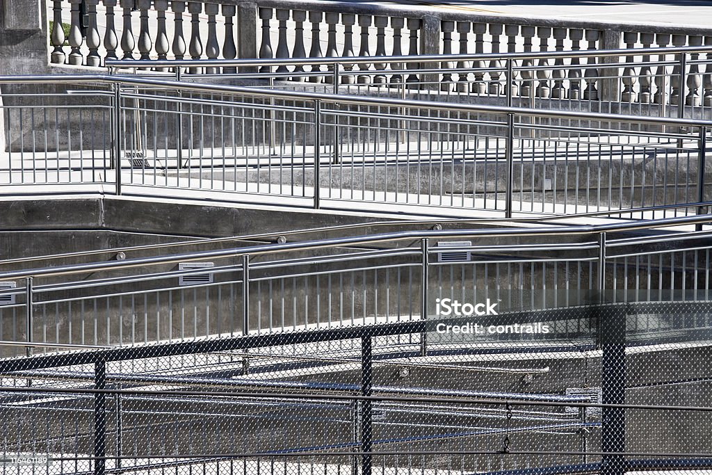 Dizzying array of handrails. Access ramp to light rail station in Pasadena, California. Wheelchair Ramp Stock Photo
