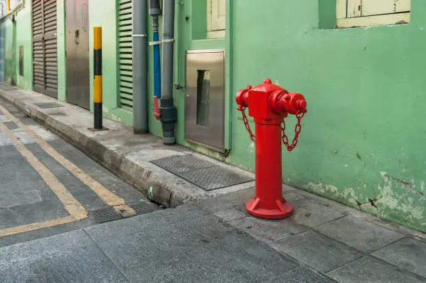 Photo of Red hydrant booster, fire hydrant on the street