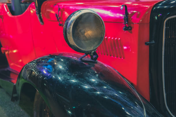 istock headlight of red vintage old classic car 1164612792