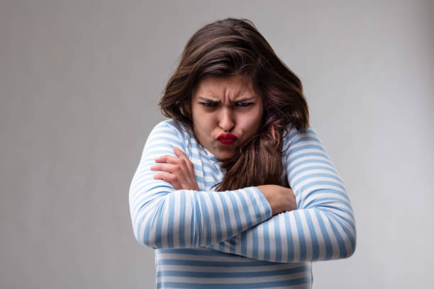 istock Sulky young woman pulling a funny face 1164622970