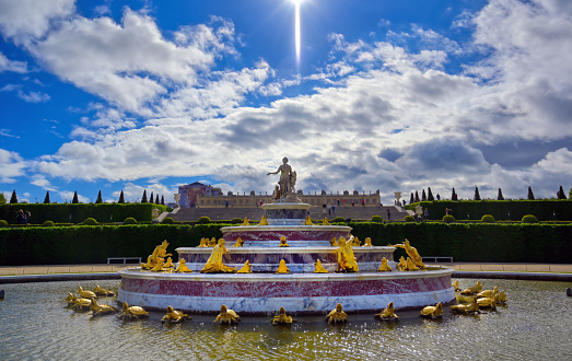 Versailles, France - April 24, 2019: Fountain of Latona in the garden of Versailles Palace on a sunny day outside of Paris, France.