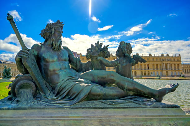 Versailles, France - April 24, 2019: The statues and fountains in and around the garden of Versailles Palace on a sunny day outside of Paris, France.