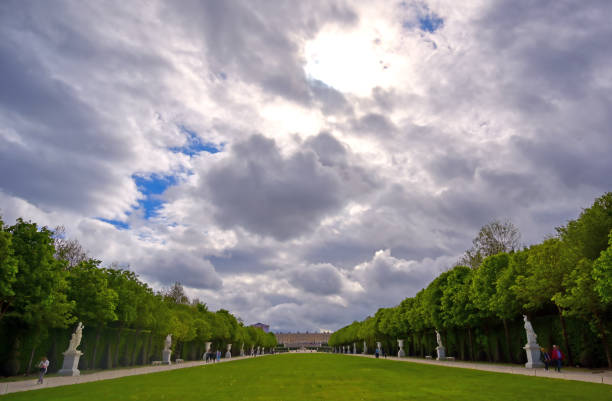 Versailles, France - April 24, 2019: The statues and fountains in and around the garden of Versailles Palace on a sunny day outside of Paris, France.