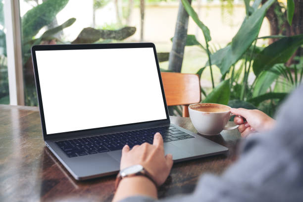 istock woman using and touching laptop touchpad with blank white desktop screen 1164629768