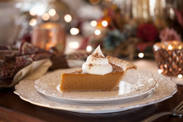Pumpkin Pie Thanksgiving holiday pumpkin pie with whipped topping. sweet pie stock pictures, royalty-free photos & images