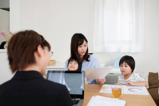 istock Insurance agent explaining about contract to family 1164638629