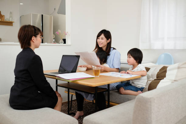 istock Insurance agent explaining about contract to family 1164638658