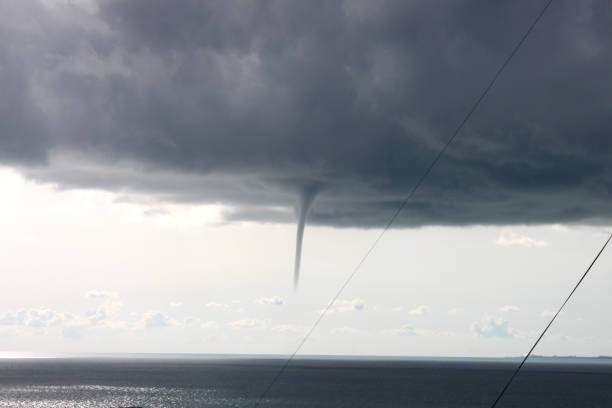 Formation of a tornado over the sea Formation of a tornado over the sea georgia tornado stock pictures, royalty-free photos & images