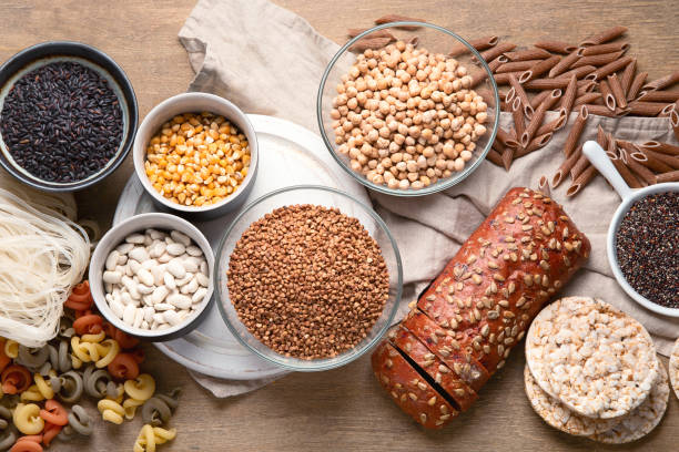 istock Various gluten free foods on wooden background. 1164641321
