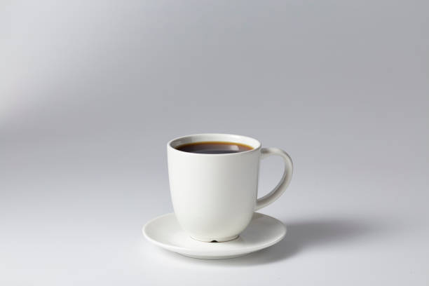 istock Cup of coffee black on bright gray background 1164642125