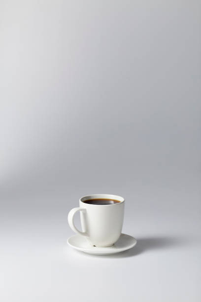 istock Cup of coffee black on bright gray background 1164642155