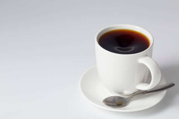 istock Cup of coffee black on bright gray background 1164642162