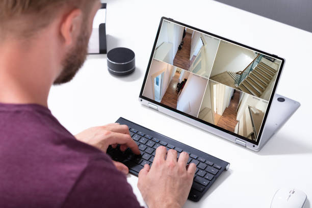 istock Businessman checking CCTV camera footage on laptop 1164644052