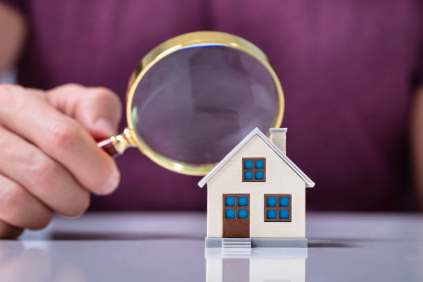 istock House Model Seen Through Magnifying Glass 1164644224