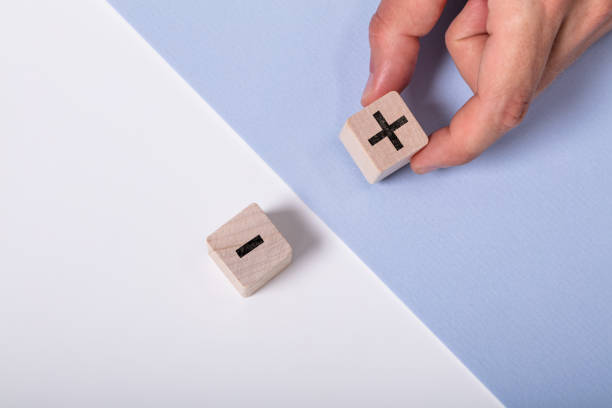 istock Person Holding Plus Sign Block 1164644237