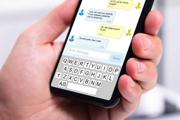 istock Person s hand holding mobile phone 1164644304