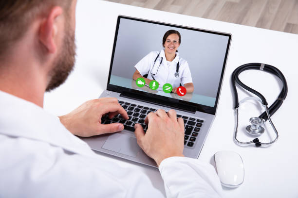 istock Doctor Having Video Conference On Laptop 1164644317