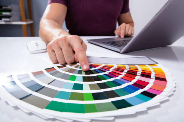 istock Architect's Hand Choosing Color From Swatch 1164644339