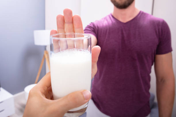 istock Man Rejecting Glass Of Milk 1164644368