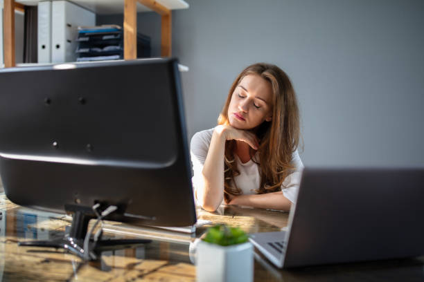 istock Businesswoman Working At Office With Computer On Desk 1164644773