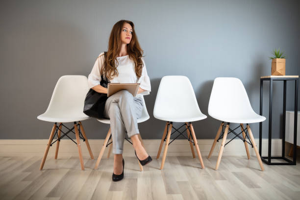 istock Young Woman Waiting For Job Interview 1164644827