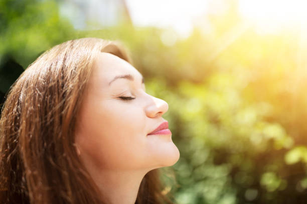 istock Young Woman Breathing Fresh Air 1164644856