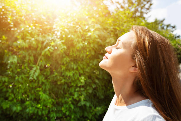 istock Young Woman Breathing Fresh Air 1164644858