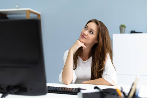 istock Thoughtful Businesswoman Looking Up 1164644859