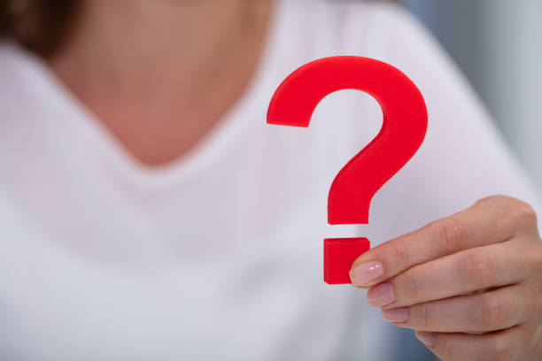 istock Businesswoman Holding Question Mark Sign 1164645423