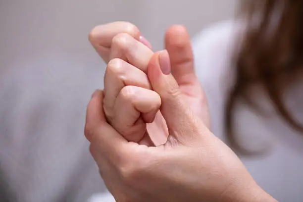 Photo of Woman Cracking Their Knuckles