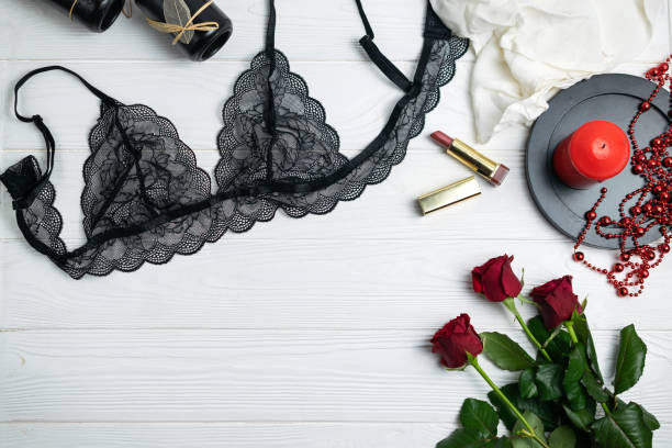istock Black lace elegant lingerie composition with red roses and candle 1164649361