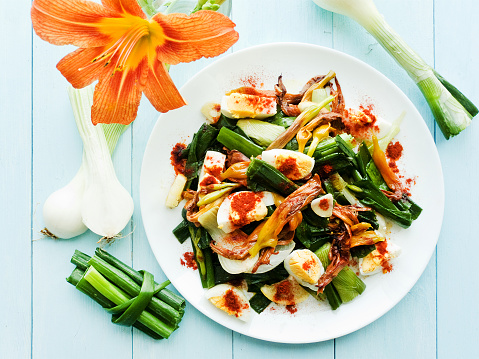 Daylily flowers salad with boiled eggs. Shallow dof.