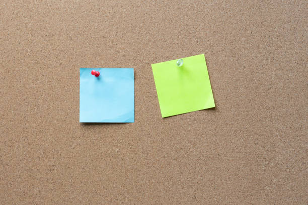 istock sticky note with tack on a cork bulletin board 1164653853