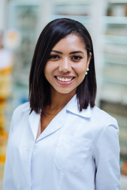 istock Portrait of pretty chemist that smiling on camera 1164653890