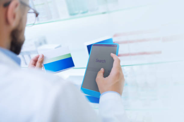 istock Close up of male hand that holding tablet 1164653913