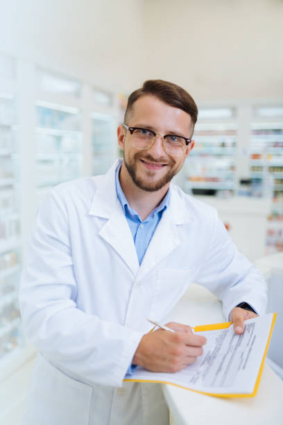istock Cheerful young apothecary working with great pleasure 1164653942