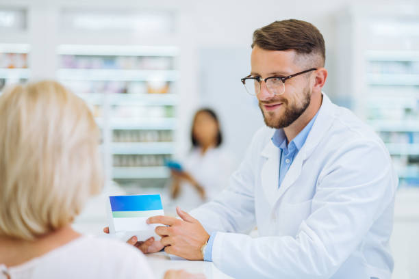 istock Cheerful young male person pointing at pills 1164653992