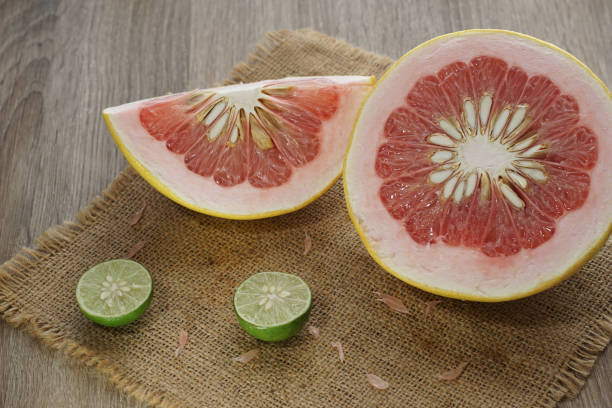 istock slices of pummelo and lime citrus on burlap served on table top 1164655000