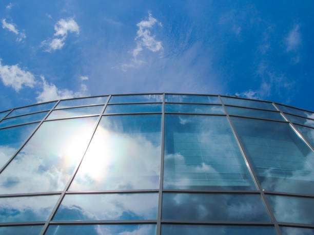 istock Modern glass building against blue sky background. 1164656780