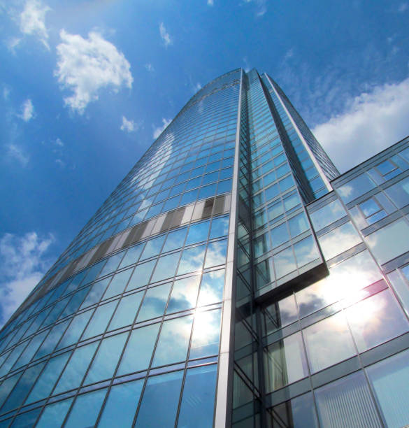 istock Modern glass building against blue sky background. 1164656781