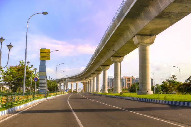 istock City over bridge with highway road at sunrise. 1164657841